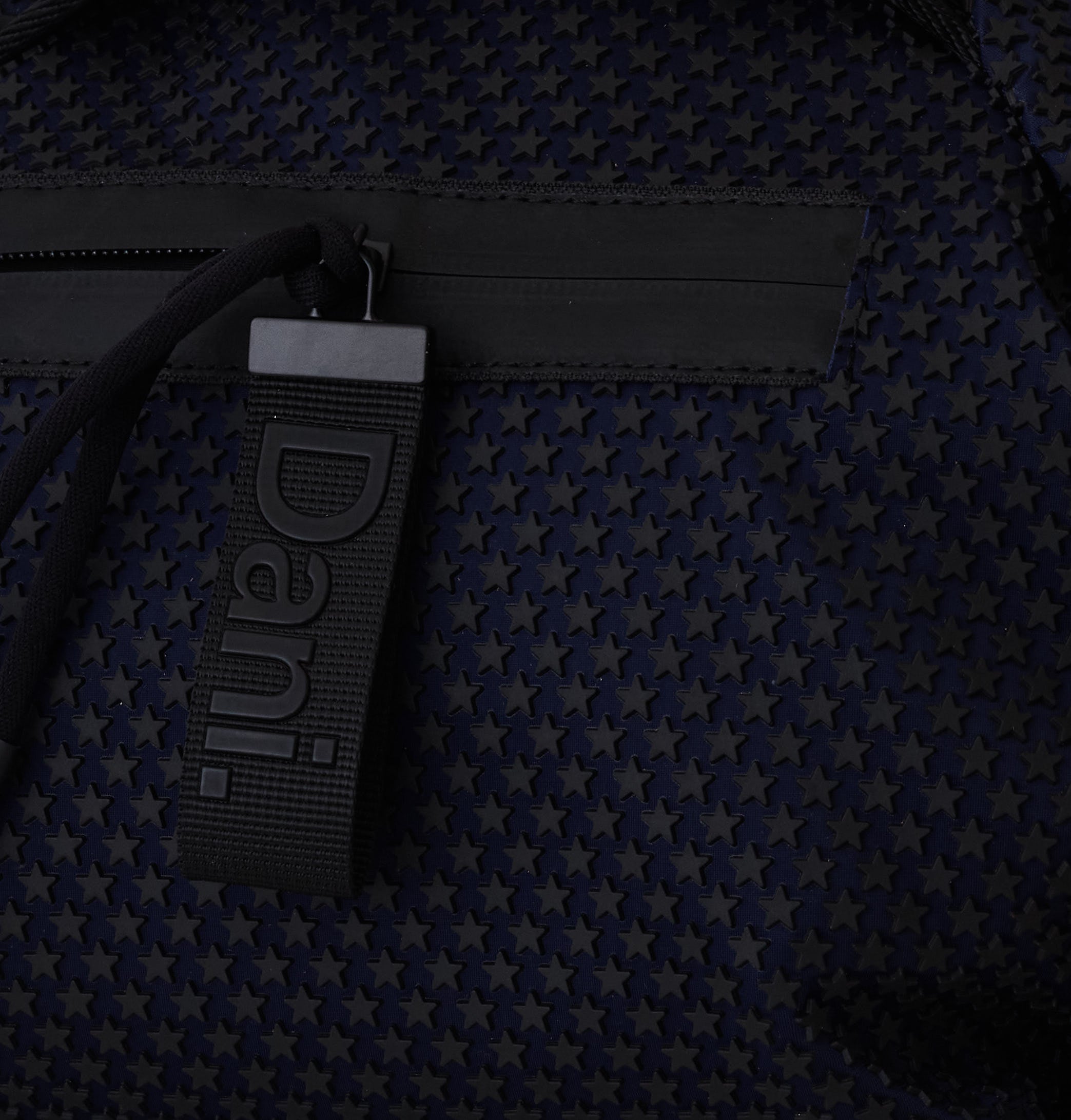 Black strap with a brand logo on a textured dark background