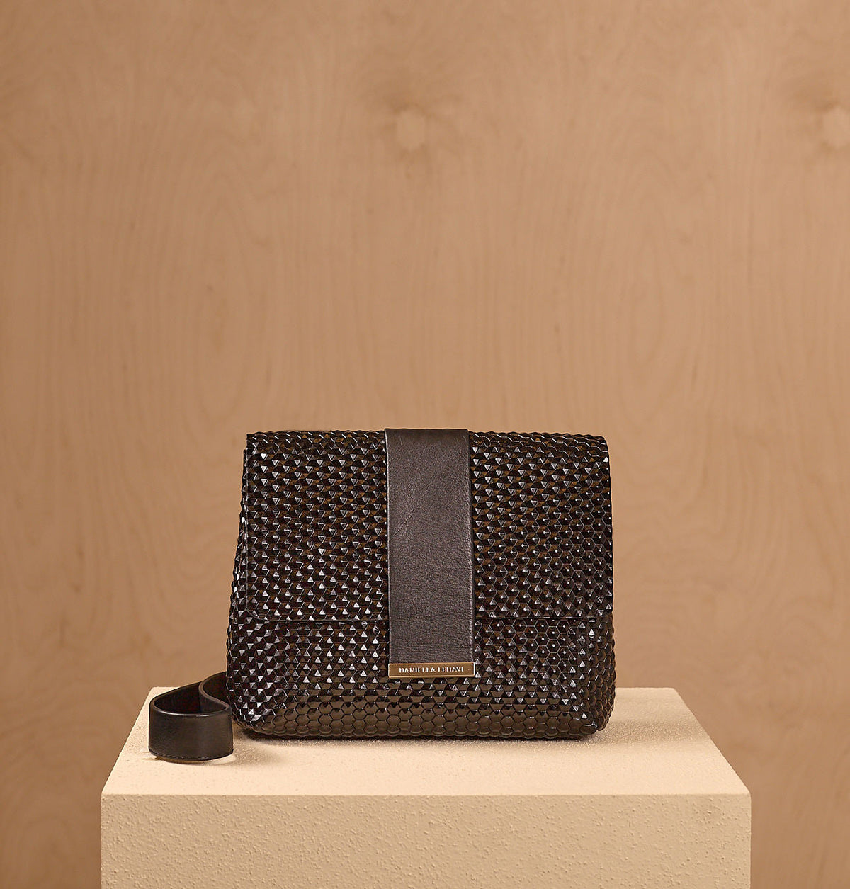 Alexa Messenger bag in black with a textured design and a sleek strap.